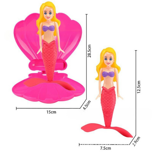 Šokanti undinėlė su kriaukle, atsidarančia vandenyje