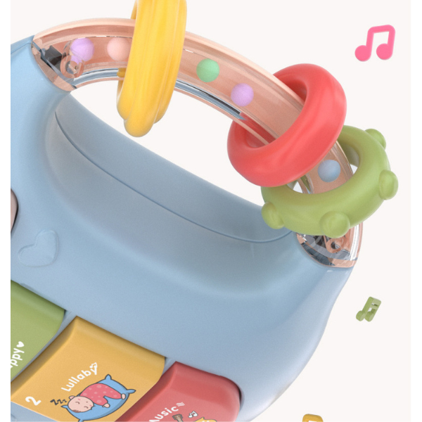 Raminantis pieno buteliuko formos barškutis su garsais ir šviesomis