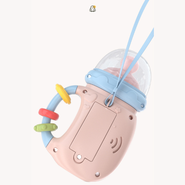 Raminantis pieno buteliuko formos barškutis su garsais ir šviesomis